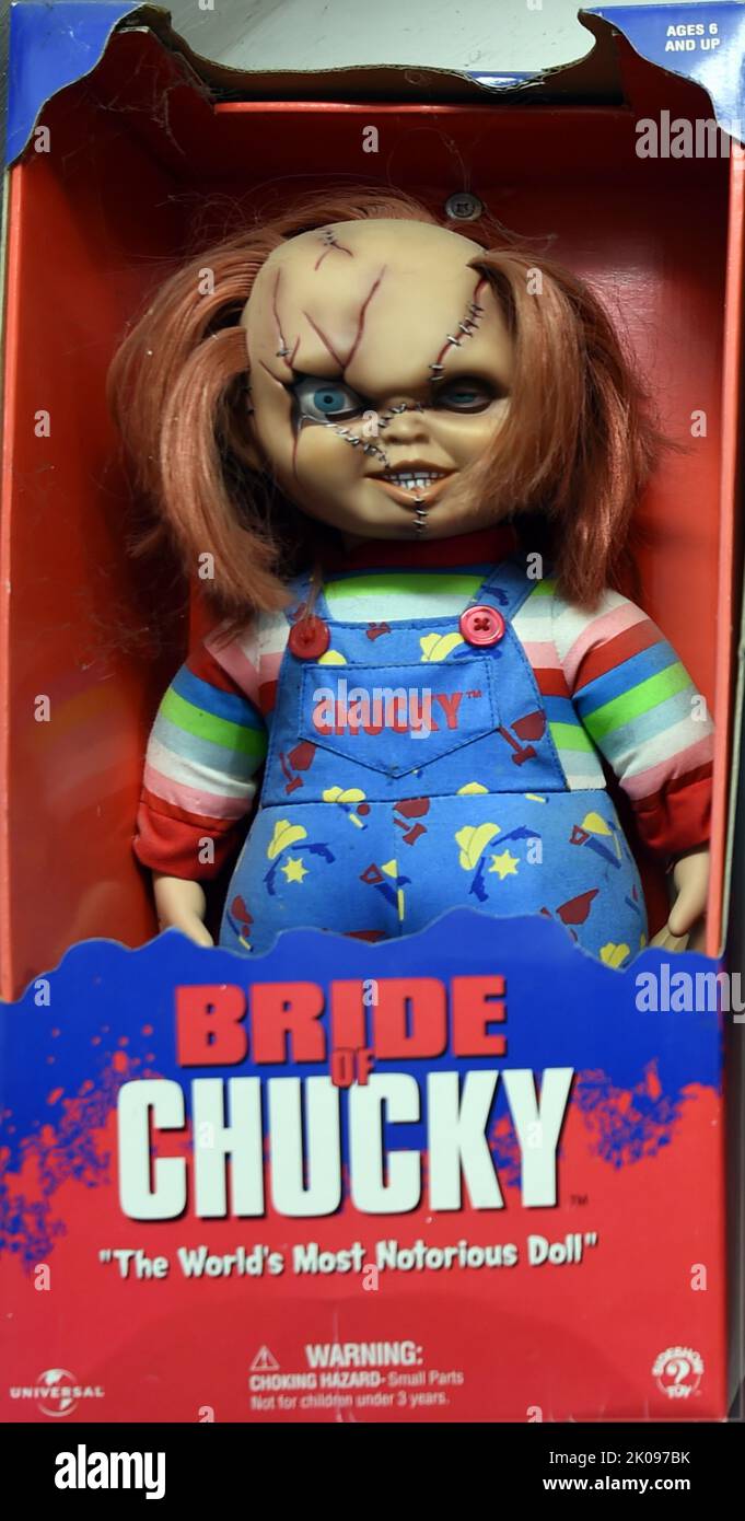 Toy made as part of the Charles Lee 'Chucky' Ray, fictional character and the main antagonist of the Child's Play slasher film franchise. Chucky is portrayed as a vicious serial killer who, as he bleeds out from a gunshot wound, transfers his soul into a 'Good Guy' doll and continuously tries to transfer to a human body. The character has become one of the most recognizable horror icons and has been referenced numerous times in popular culture. Stock Photo