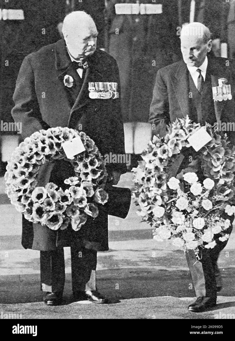 Winston Churchill and Clement Attlee laying their wreaths at The Cenotaph. Sir Winston Leonard Spencer Churchill, KG, OM, CH, TD, DL, FRS, RA (30 November 1874 - 24 January 1965) was a British statesman who served as Prime Minister of the United Kingdom from 1940 to 1945, during the Second World War, and again from 1951 to 1955. Best known for his wartime leadership as Prime Minister, Churchill was also a Sandhurst-educated soldier, a Nobel Prize-winning writer and historian, a prolific painter, and one of the longest-serving politicians in British history. Clement Richard Attlee, 1st Earl Att Stock Photo