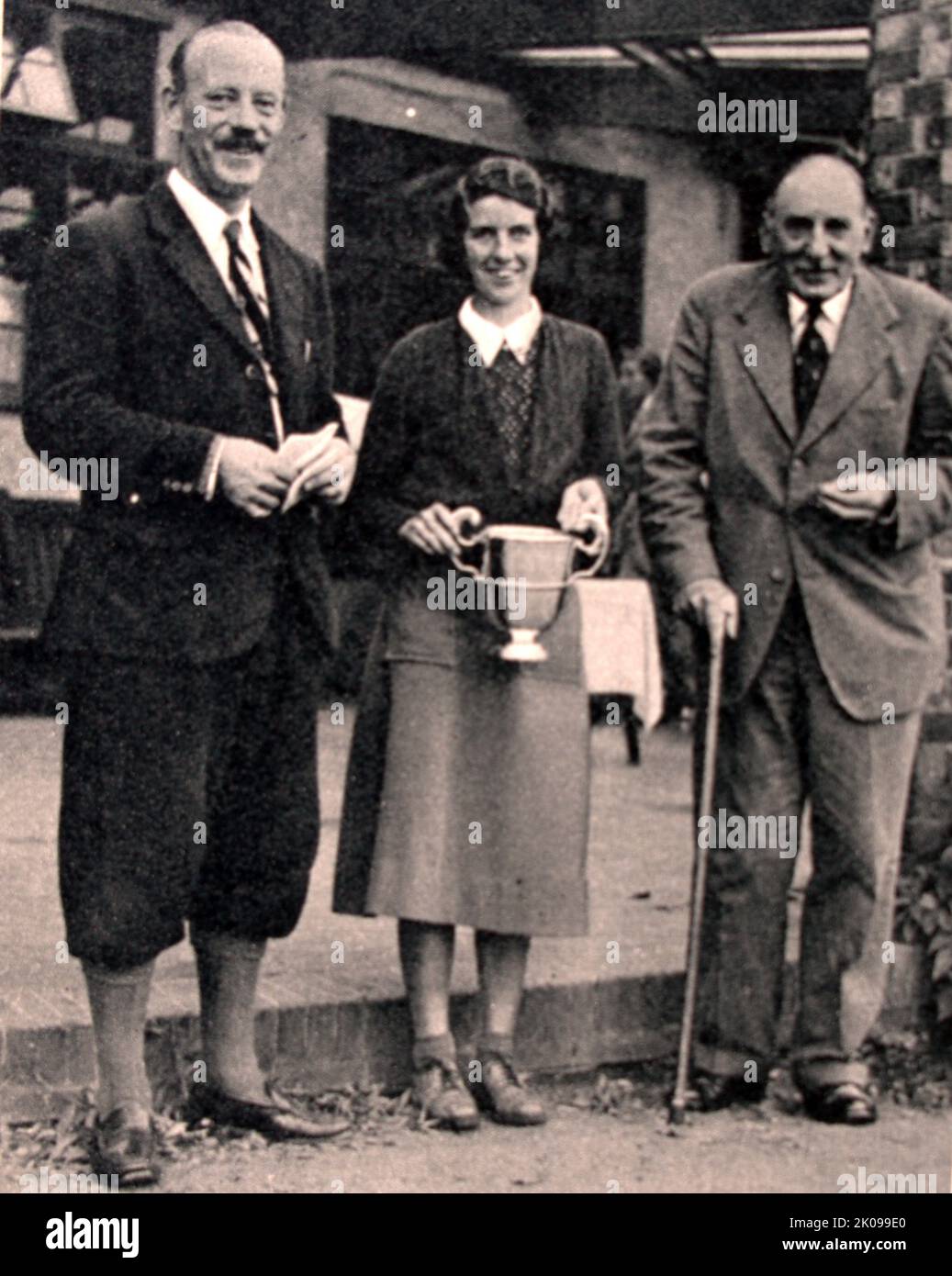 Winners of the Worplesdon Mixed Foursomes: Miss Frances Stephens and Mr Leonard Crawley with Mr Bernard Darwin. Golf tournament. Stock Photo