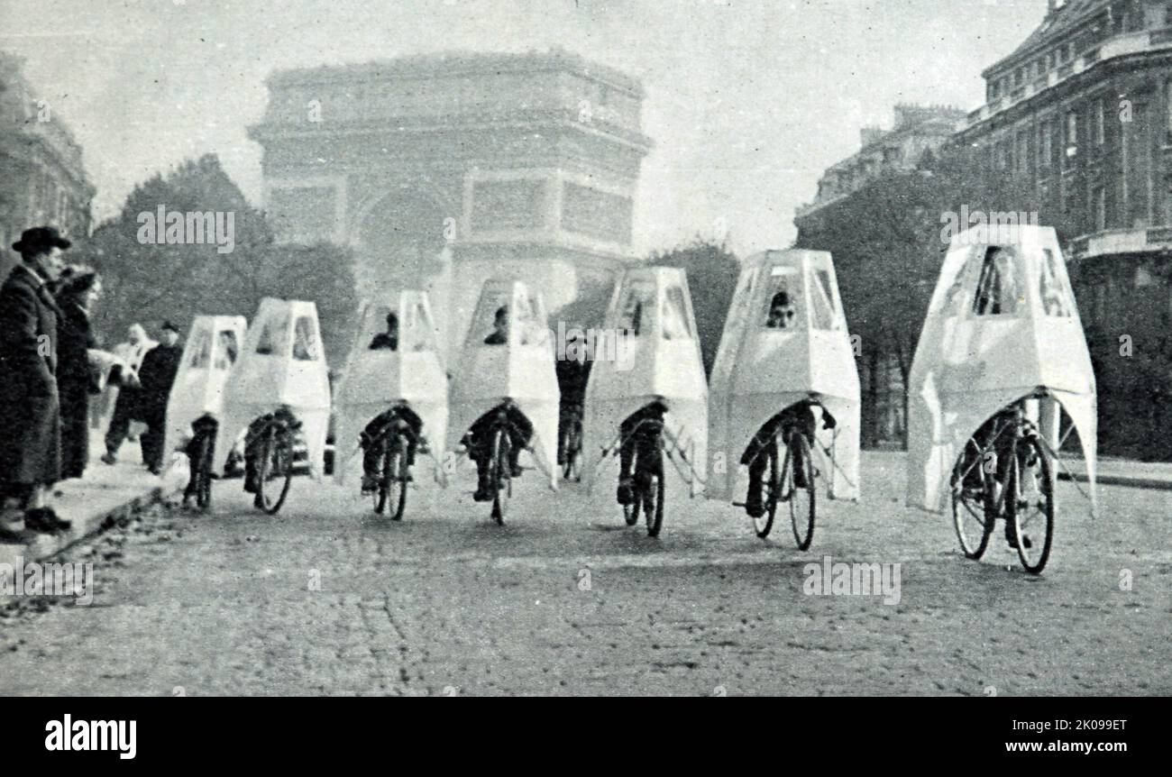 Waterproof cycles with side doors in Paris. Newspaper report and photograph. Stock Photo