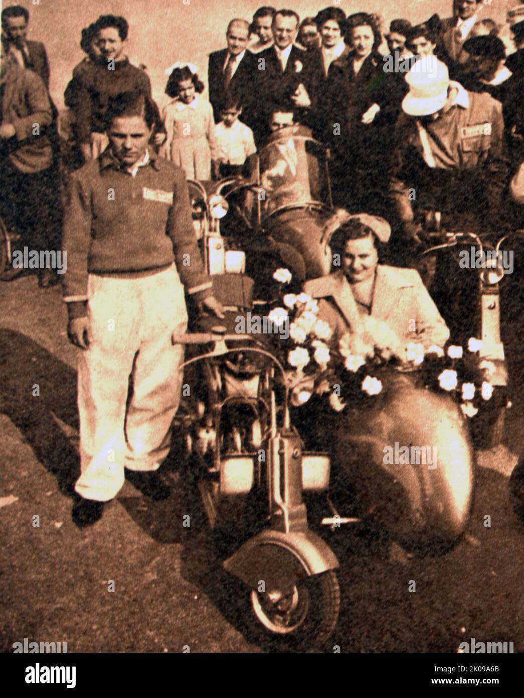 Young couple going on honeymoon in their motor scooter and sidecar in