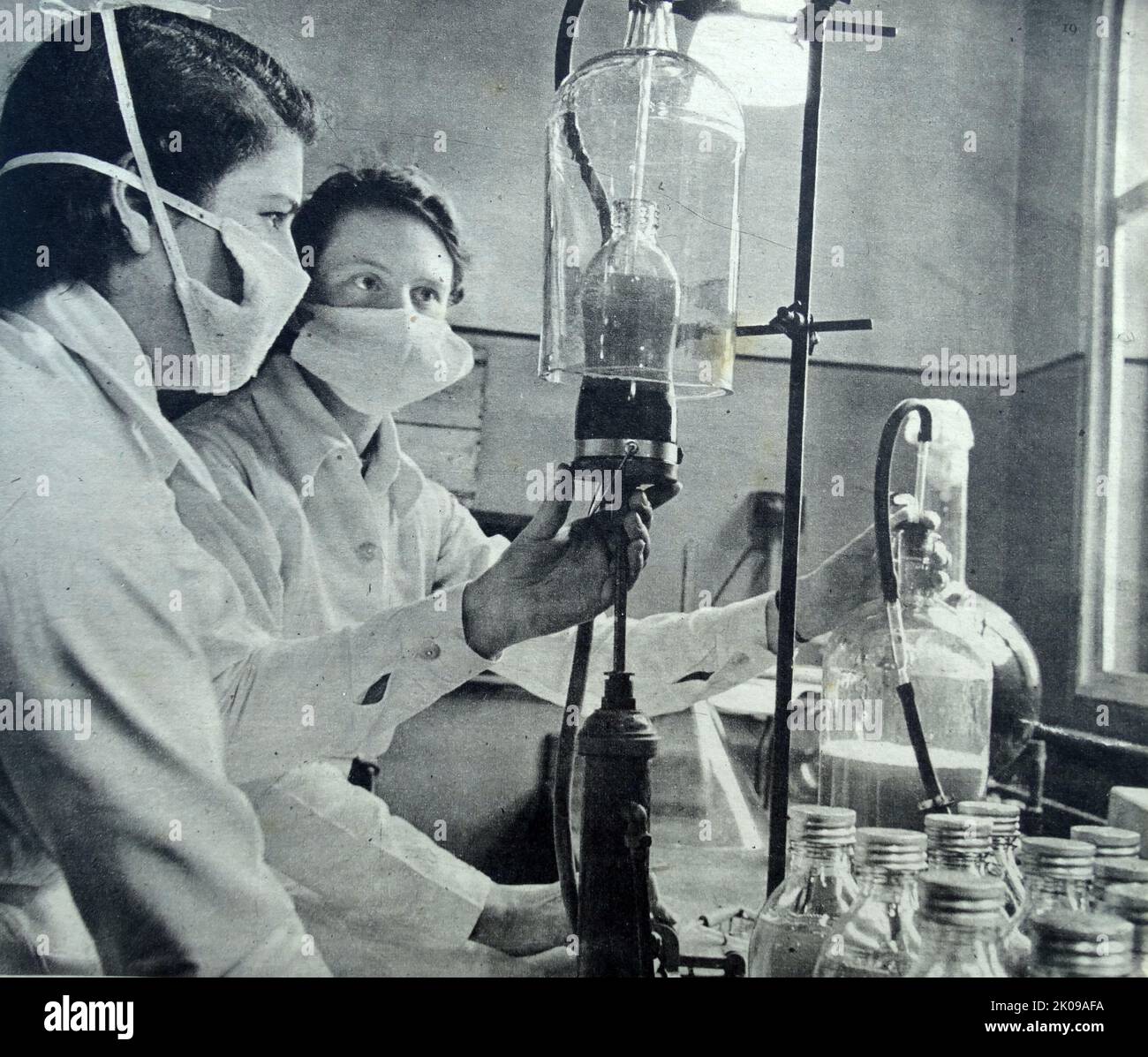 Blood plasma being produced by medical scientists. Stock Photo