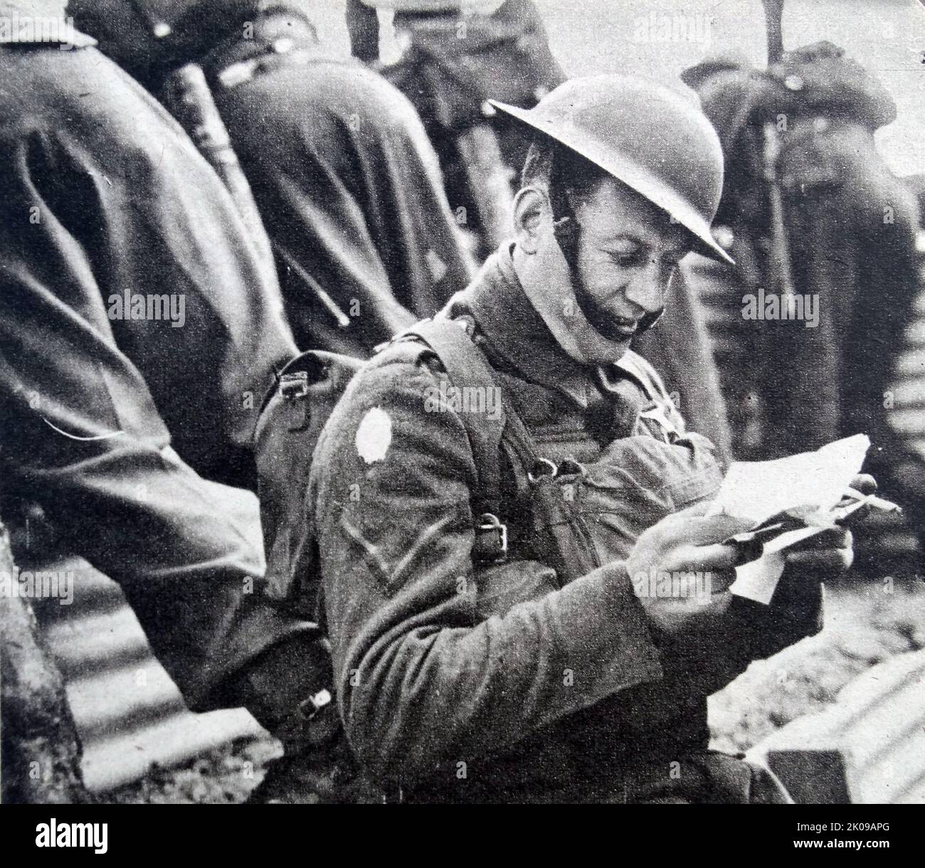 Lance Corporal Batten in Turcoing, France, opening his mail from home in 1939. Stock Photo