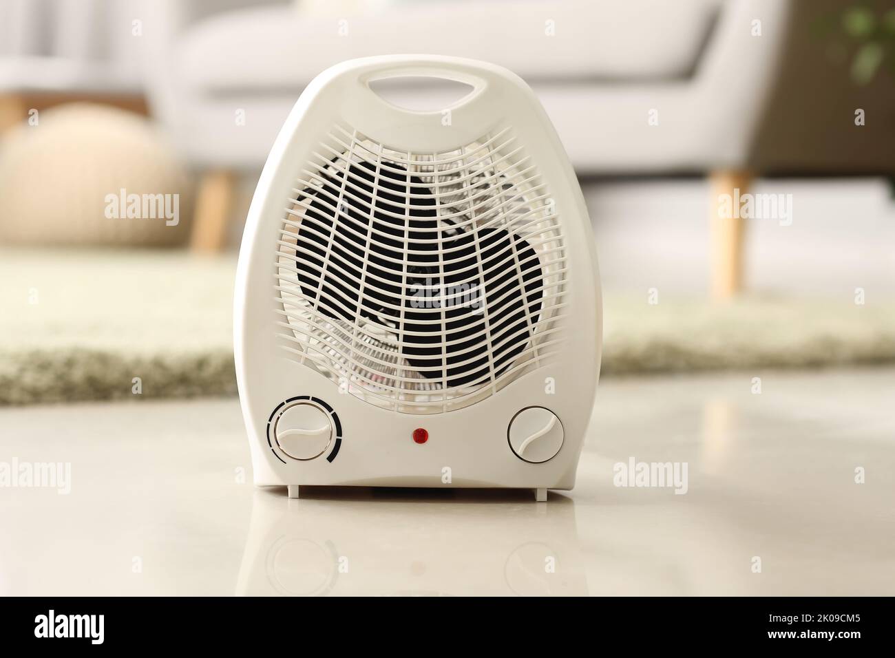 Electric fan heater on floor in living room Stock Photo Alamy
