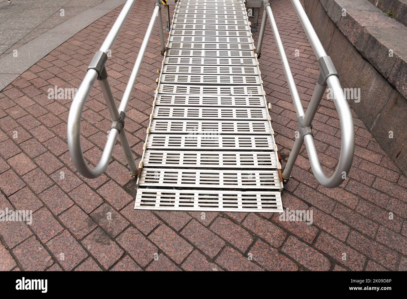Steel ramp for wheelchairs metal ramp for disabled people stock photo