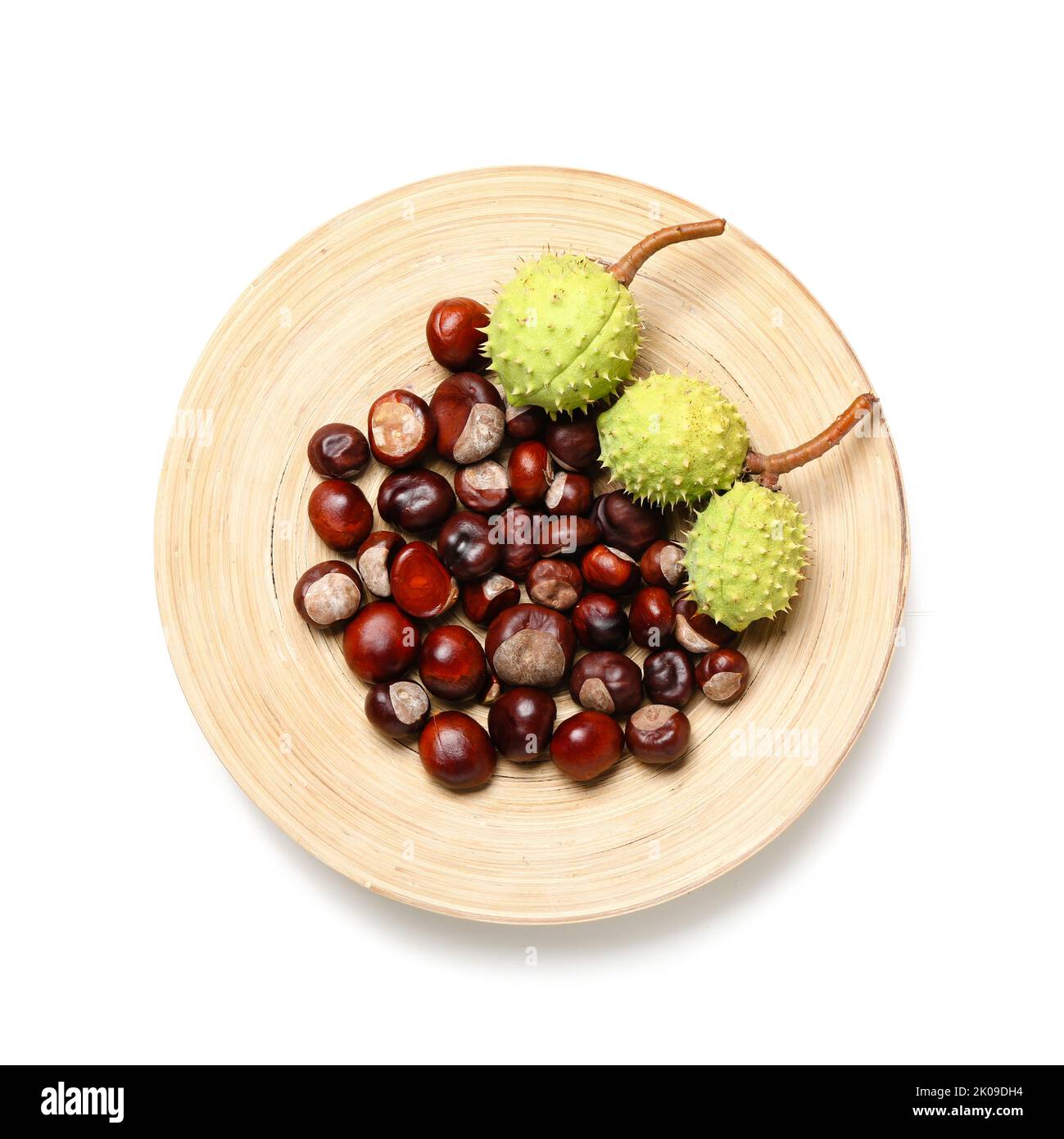 Plate with chestnuts on white background Stock Photo