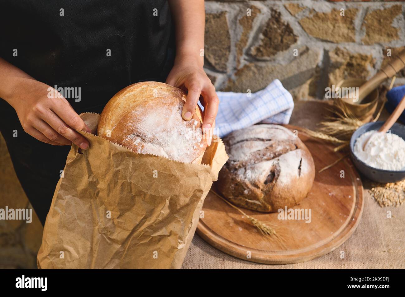 Closeup of packing a traditional homemade sourdough bread into an eco