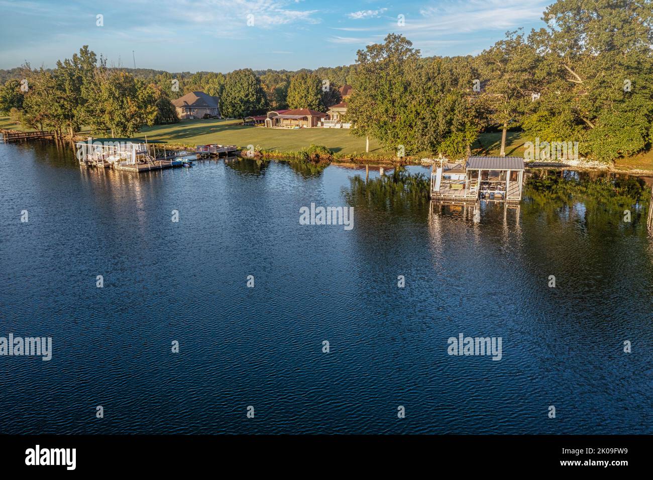 Aerial shot of a waterfront lake home with floating boat dock on Tims Ford Lake in Tennessee