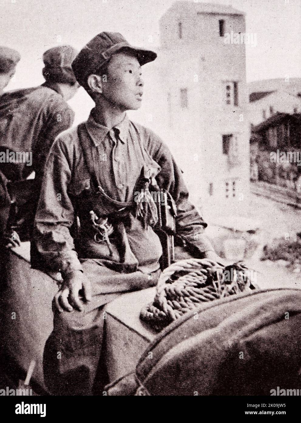 Communist Chinese Red Army boy soldier in 1949. The Chinese Workers' and Peasants' Red Army or Chinese Workers' and Peasants' Revolutionary Army, commonly known as the Chinese Red Army or simply the Red Army, was the armed forces of the Chinese Communist Party from 1928 to 1937. Stock Photo