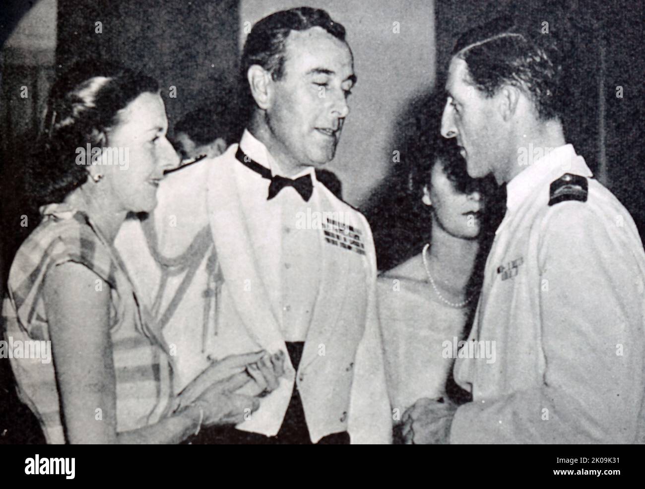 Lord and Lady Mountbatten with Commander John Kerans at the Gala dance in Valetta, Malta. Louis Francis Albert Victor Nicholas Mountbatten, 1st Earl Mountbatten of Burma (born Prince Louis of Battenberg; 25 June 1900 - 27 August 1979), was a member of the British royal family, Royal Navy officer and statesman. During the Second World War, he was Supreme Allied Commander, South East Asia Command. Commander John Simon Kerans DSO (30 June 1915 - 12 September 1985) was an officer in the Royal Navy and later a Conservative Party politician. Stock Photo