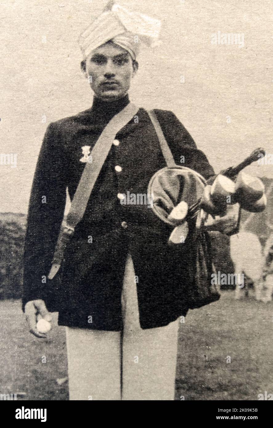 Viceroy's caddie with his master's golf bag in India. Stock Photo