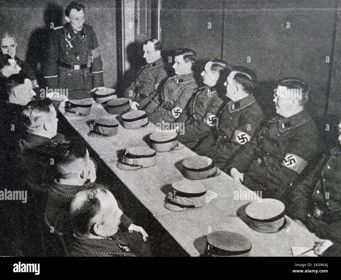 Johann Laub, at the local branch of a Nazi Storm Troopers meeting. The Sturmabteilung was the Nazi Party's original paramilitary wing. It played a significant role in Adolf Hitler's rise to power in the 1920s and 1930s. Stock Photo