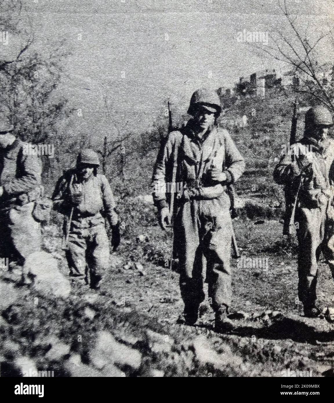 Soldiers get some respite from heavy shelling near Vittoria, Sicily, during World War II. Stock Photo
