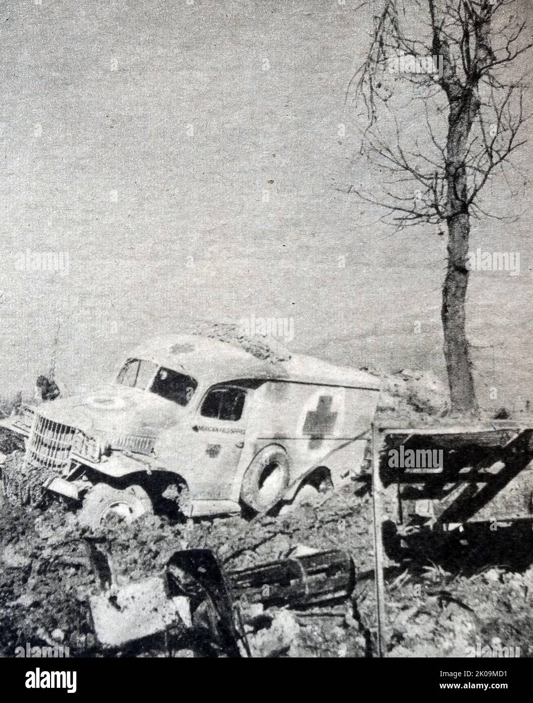 Anti-Personnel Bomb: A British Red Cross ambulance hit by a Messerschmitt during World War II. Messerschmitt AG was a German share-ownership limited, aircraft manufacturing corporation named after its chief designer Willy Messerschmitt, and known primarily for its World War II fighter aircraft, in particular the Bf 109 and Me 262. Stock Photo