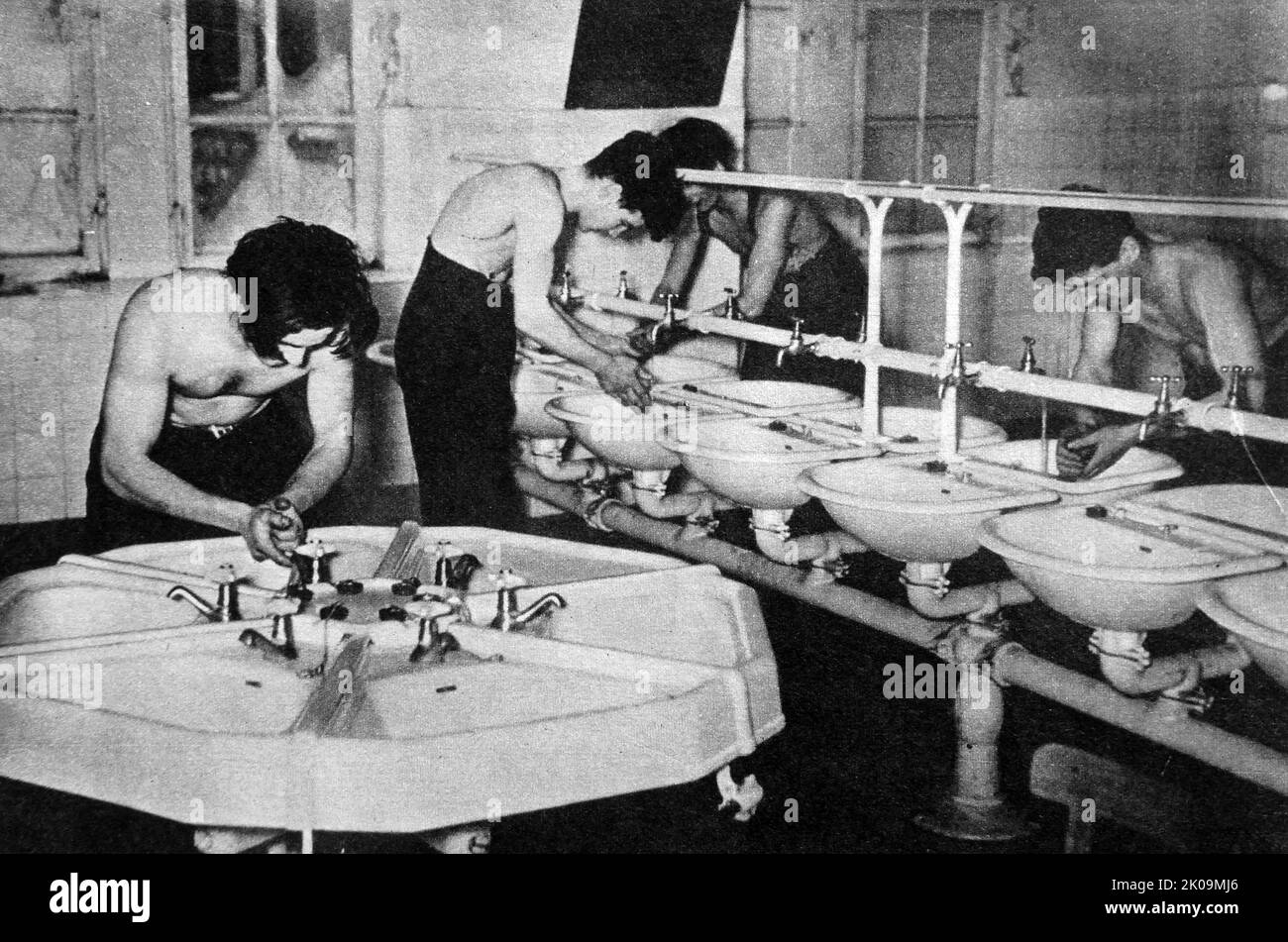 Captives using special washrooms at Wulzburg German prisoner of war camp during World War II. Stock Photo