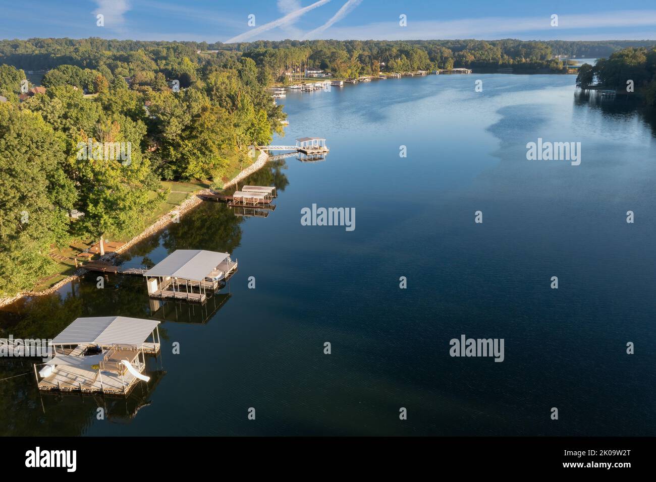 Aerial shot of a waterfront lake home with floating boat dock on Tims Ford Lake in Tennessee