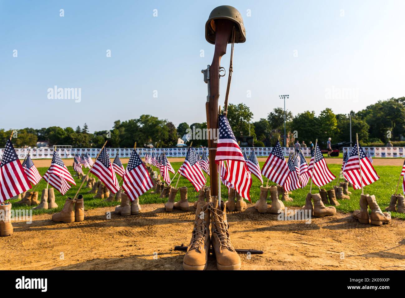 Soldier's rifle stuck into the soldier's boots with helmet on top at ...