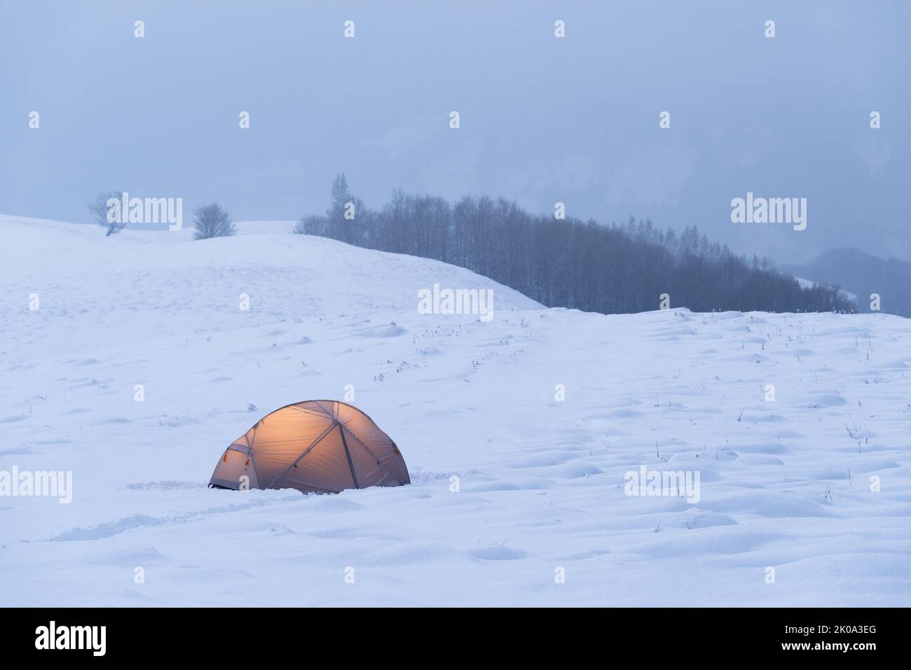 Winter view with tourist tent in snowy mountains Stock Photo