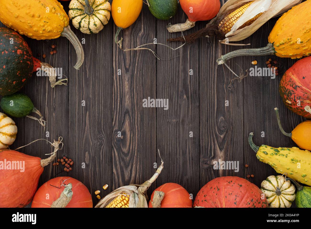 Autumn background with pumpkin frame on vintage wooden background Stock Photo