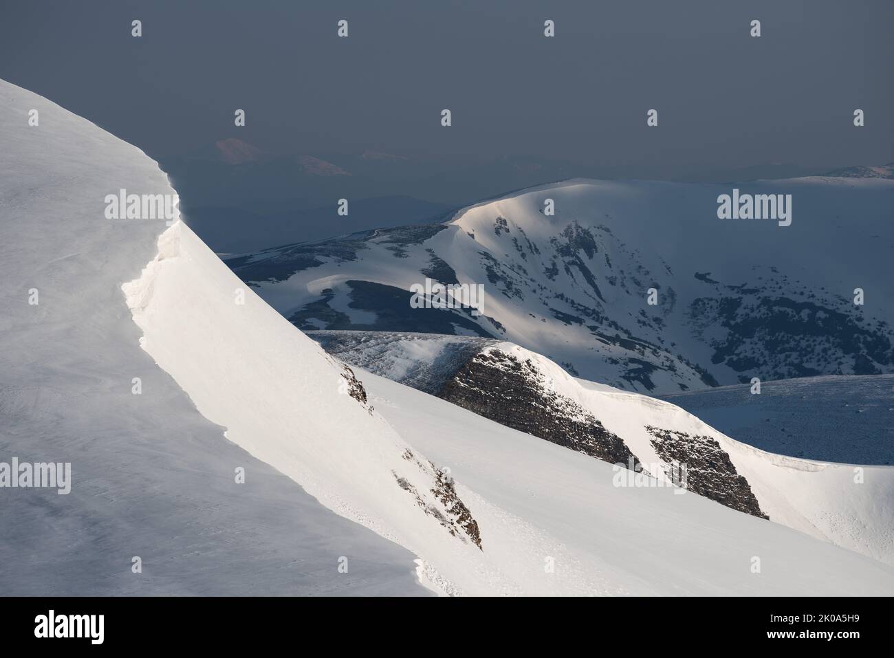 Spring view of the mountain range in the snow Stock Photo