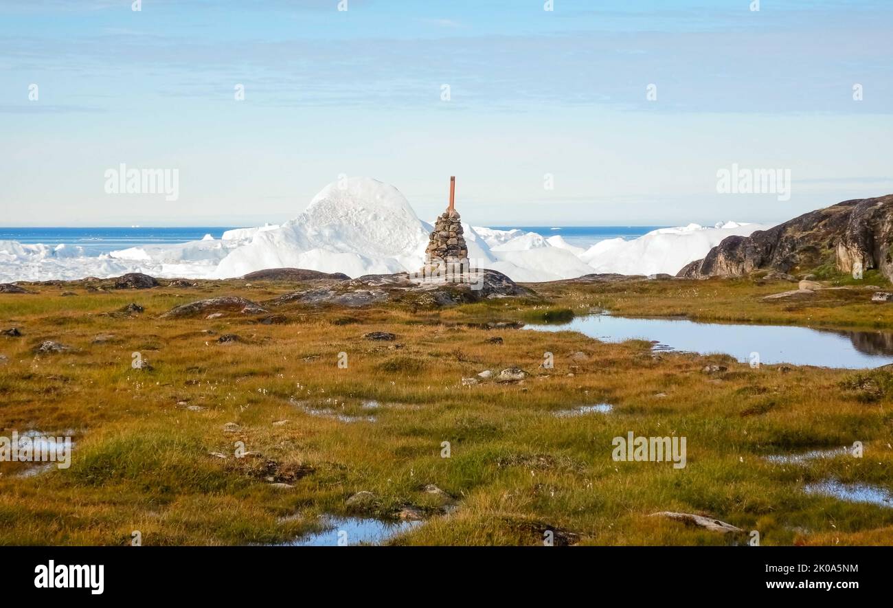 Greenland Rocks Rock cairn on tundra at Ilulissat Icefiord, Greenland. , a Unesco World ...