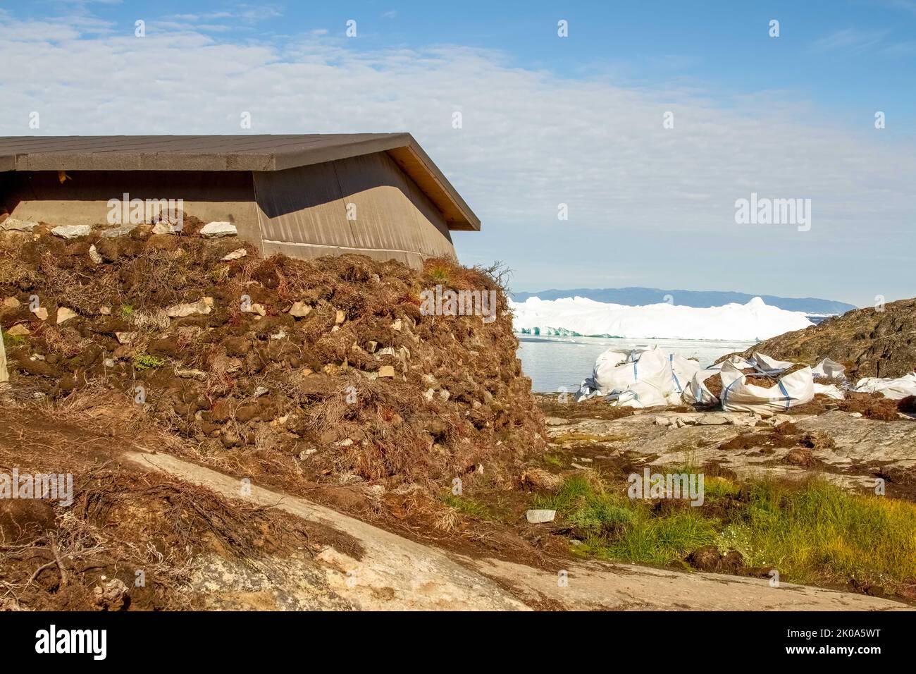 Constrtuction of traditional sod house at Ilulissat Icefiord, Greenland. , a Unesco World Heritage Site. Stock Photo