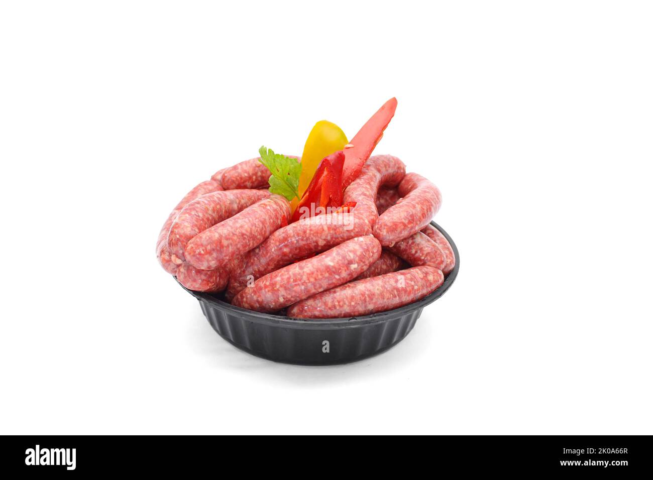 Raw sausages in grey dish isolated on white background Stock Photo Alamy