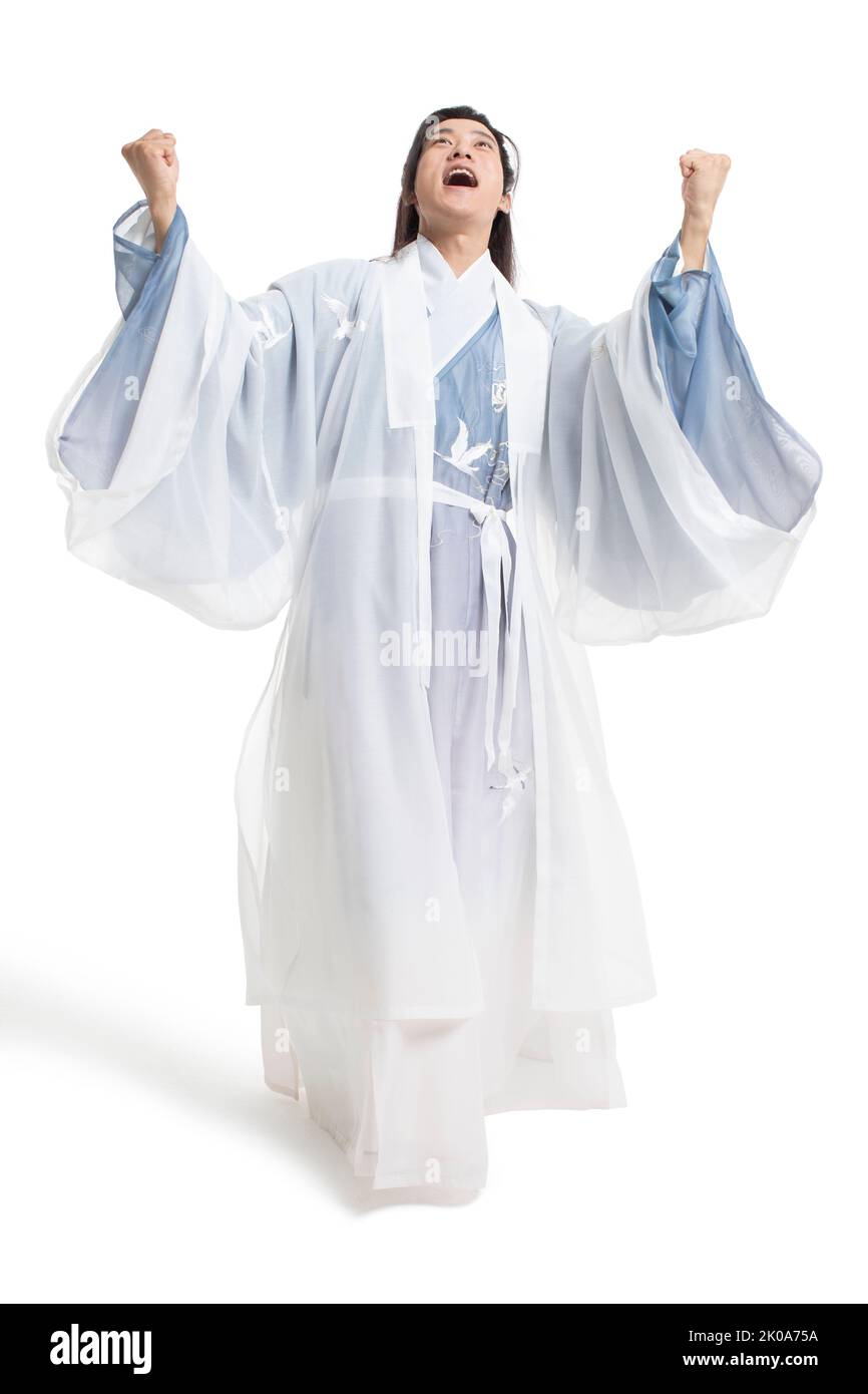 Cheerful young Chinese man in ancient costume Stock Photo