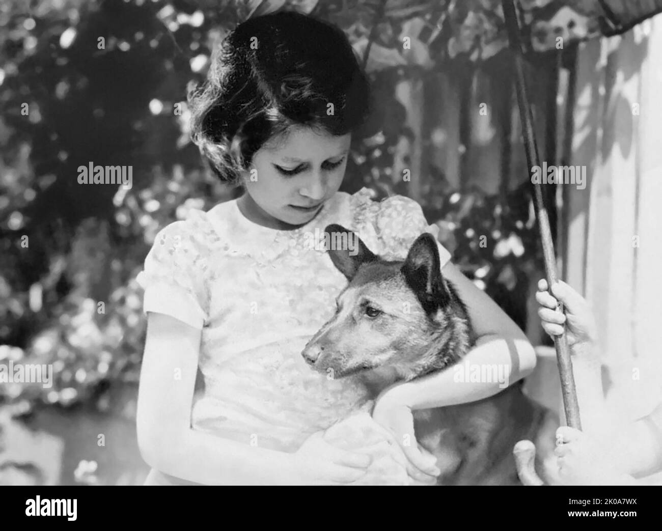 Young Princess Elizabeth (c1938) with her pet corgi, a breed of Welsh herding dogs the future Queen would dearly love throughout her lifetime. (UK) Stock Photo