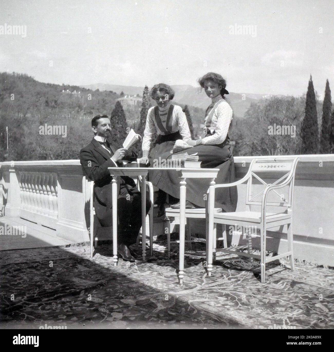Pierre Gilliard with his pupils, Grand Duchess Olga Nikolaevna of Russia and Grand Duchess Tatiana Nikolaevna of Russia at Livadia in 1911. Pierre Gilliard (16 May 1879 - 30 May 1962) was a Swiss academic and author, best known as the French language tutor to the five children of Emperor Nicholas II of Russia from 1905 to 1918 Stock Photo