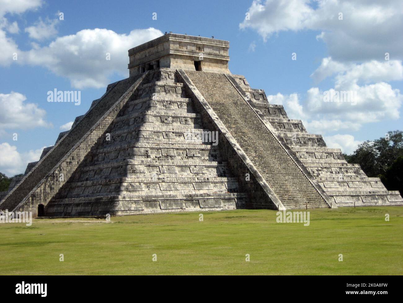 La Piramide, known as the Temple of Kukulca, a Mesoamerican step-pyramid that dominates the centre of the Chichen Itza archaeological site in the Mexican state of Yucatan. The pyramid building is more formally designated by archaeologists as Chichen Itza Structure 5B18. Built by the pre-Columbian Maya civilization between the 8th and 12th centuries AD, the pyramid served as a temple to the deity Kukulcan, the Yucatec Maya Feathered Serpent deity closely related to Quetzalcoatl Stock Photo