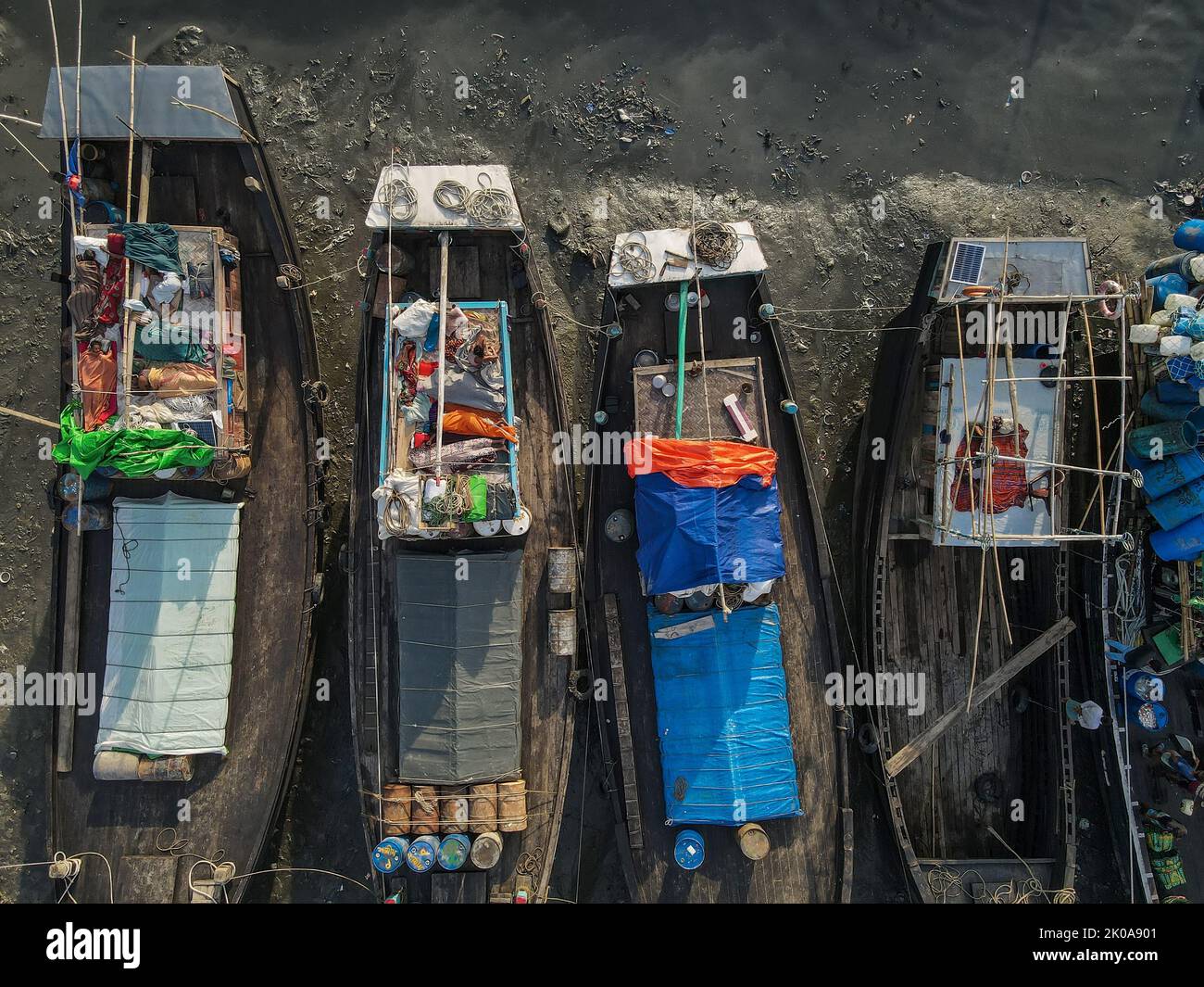 Chittagong, Chattogram, Bangladesh. 10th Sep, 2022. Chittagong, Bangladesh, 10 September 2022 : Fishermen sleeping on fishing boats. They catch fish in the deep sea all night and come to the Chittagong fishing ghat on the river bank and fatigue sleep under the open sky in the boat. Chittagong and Coxbazar is main center of sea fishing in Bangladesh.More than 40,000 families engaged with sea fishing. (Credit Image: © Muhammad Amdad Hossain/ZUMA Press Wire) Stock Photo