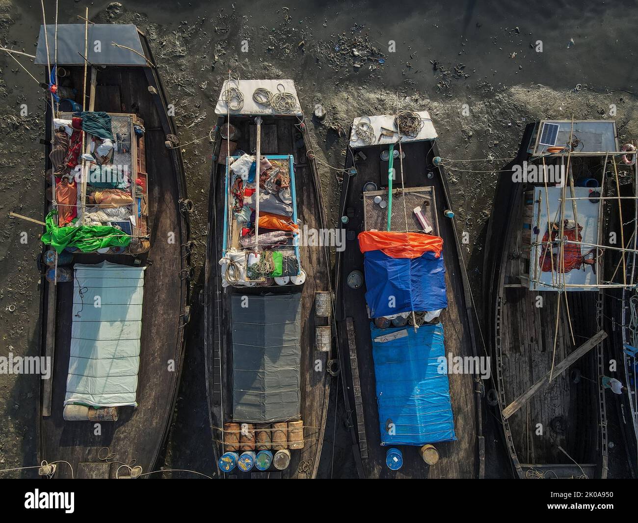 Chittagong, Chattogram, Bangladesh. 10th Sep, 2022. Chittagong, Bangladesh, 10 September 2022 : Fishermen sleeping on fishing boats. They catch fish in the deep sea all night and come to the Chittagong fishing ghat on the river bank and fatigue sleep under the open sky in the boat. Chittagong and Coxbazar is main center of sea fishing in Bangladesh.More than 40,000 families engaged with sea fishing. (Credit Image: © Muhammad Amdad Hossain/ZUMA Press Wire) Stock Photo