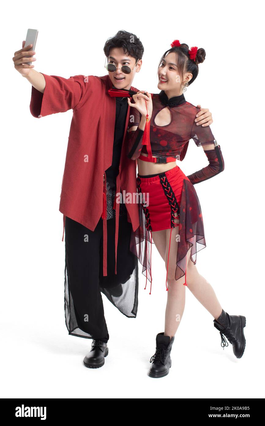Cheerful young Chinese couple taking selfie with smart phone Stock ...