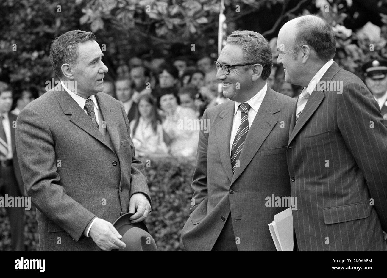 U.S. Secretary of State Henry Kissinger (centre) and another man speaking with Andrei Gromyko, Soviet minister of foreign affairs (left), during a visit of Soviet Union leader Leonid Brezhnev to Washington, D.C., 1973 Stock Photo