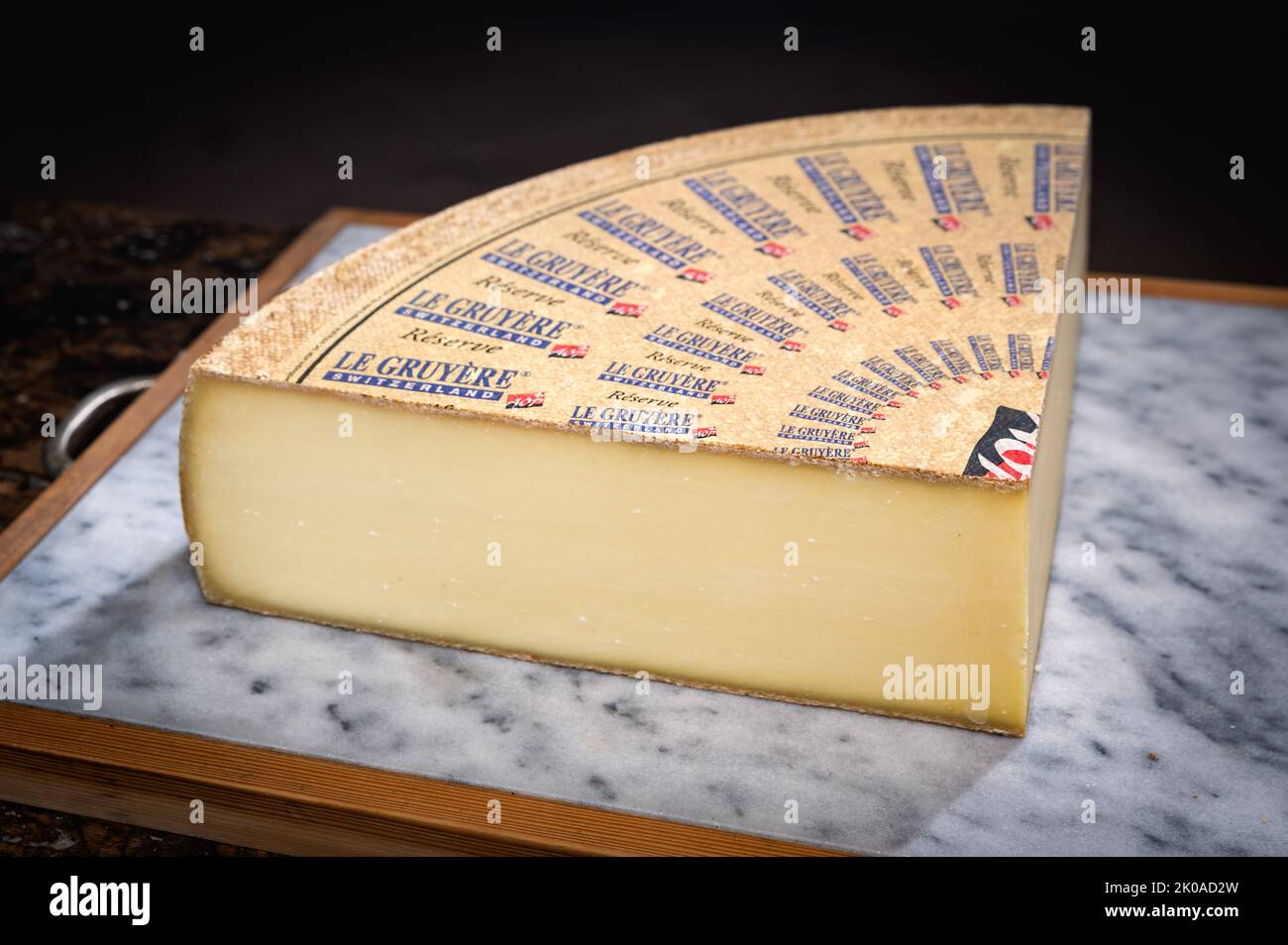 July 11 2022, Lyon, France : Switzerland cheese : Le Gruyère Réserve, famous swiss cheese in a cellar on a marbble background Stock Photo
