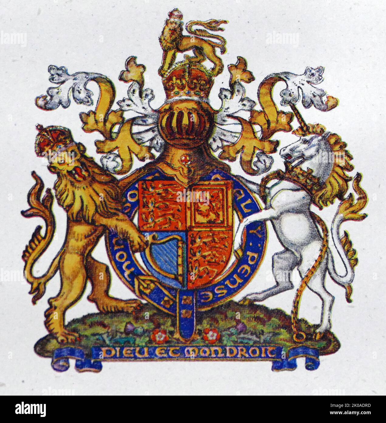 The motto appears on a scroll beneath the shield on the version of the Royal coat of arms of the United Kingdom used outside of Scotland Stock Photo