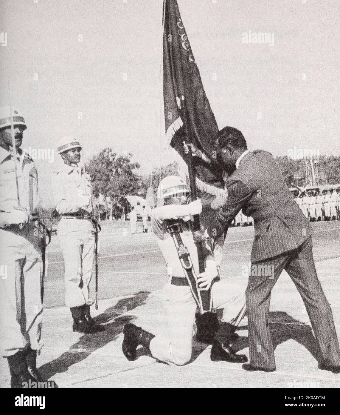 President Ziaur Rahman presenting the Bangladesh flag to an airforce honour guard, 1976 Stock Photo