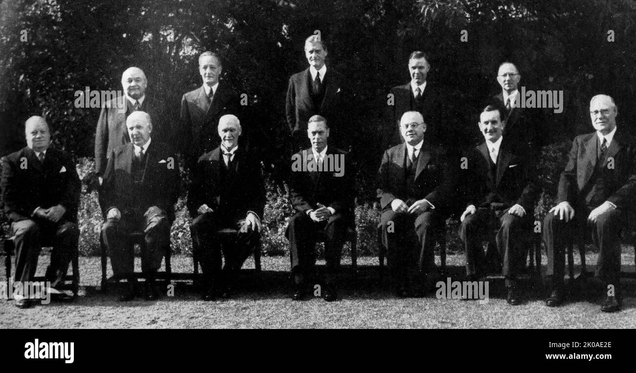 King George VI of England with his South African Cabinet. 1947. Front row, left to right: The Hon. J. W. Mushet, Minister of Posts and Telegraphs; The Hon. F. C. Sturrock Minister of Transport; Field-Marshal The Rt. Hon. J. C. Smuts, O.M., Prime Minister, Minister of External Affairs and Defence; His Majesty the King; The Rt. Hon. J. H. Hofmeyr, Minister of Finance and Education; The Hon. H. G. Lawrence, Minister of Justice, Social Welfare and Demobilization; Senator The Hon. A. M. Conroy, Minister of Lands. Back row, left to right: Dr. The Hon C. F. Steyn, Minister of Labour; The Hon C. F. Wa Stock Photo