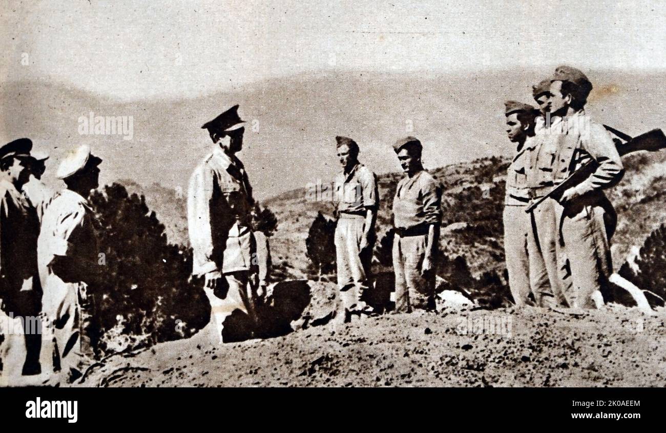 An inspection of Greek troops on the Greco-Albanian border. Country typical of that over which the fighting had been taking place. 1949 Stock Photo