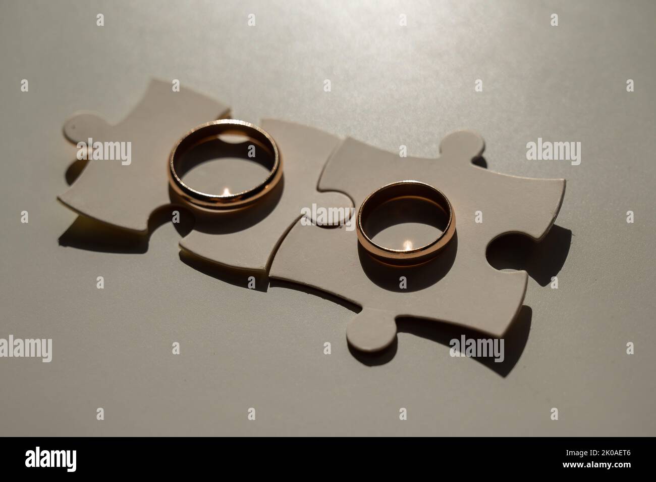Wedding rings and puzzle pieces. Husband and wife complement each other
