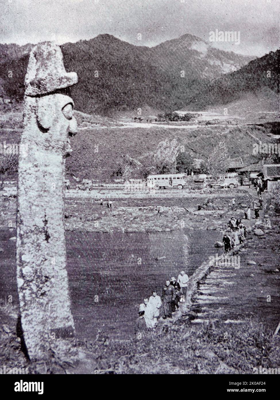 A jangseung or village guardian; a Korean totem pole usually made of wood. Jangseungs were traditionally placed at the edges of villages to mark village boundaries and frighten away demons. 1960 Stock Photo