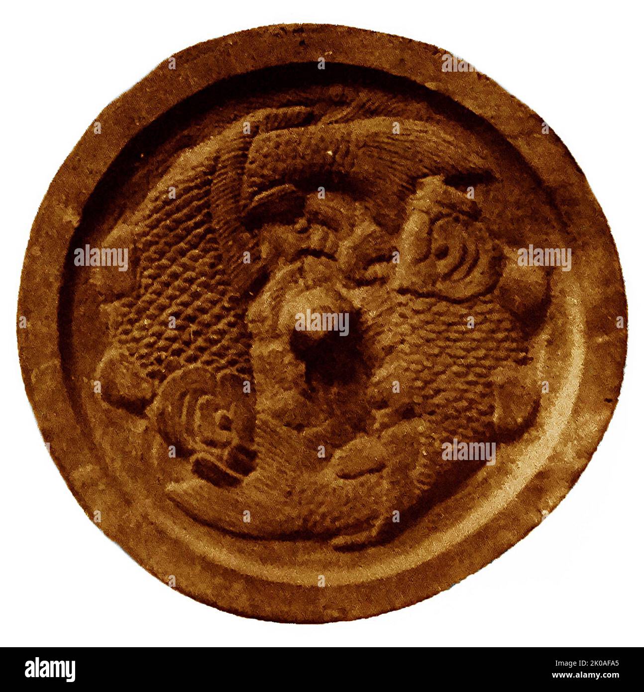 Twin carps in relief. Koryeo Dynasty (918- 1392). Bronze Mirror from 10th14th century Koryeo Dynasty, Korea Stock Photo
