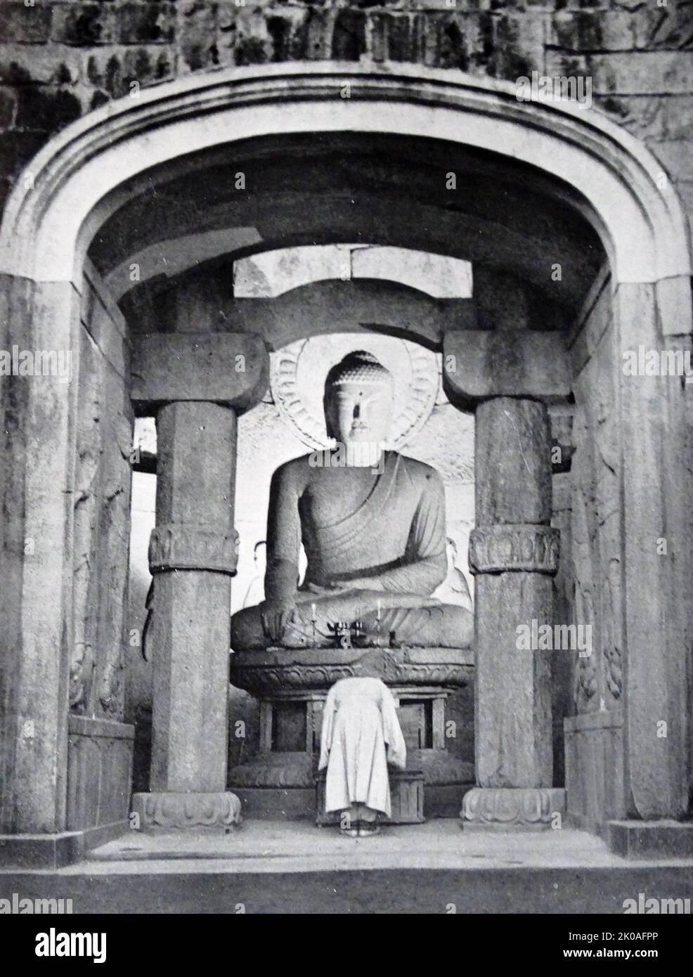 Sakyamuni Buddha in Seated Posture, from Silla period, South Korea. Height: 2.73m. It is known to be one of the greatest masterpieces of stone Buddhas in the world. It is remarked especially for its elegance and loftiness. This is the principal image in the Seok-gu-ram Grotto (Cave Temple) in Kyeongju, South Korea. The grotto is registered as a UNESCO World Heritage and as the Korean National Treasure number 24. The Seokguram Grotto was initiated in 751 by King Kyeongdeok of Silla and completed by his son in 774 by King Hyegong of Silla. The Grotto was built to illustrate the moment when Sakya Stock Photo