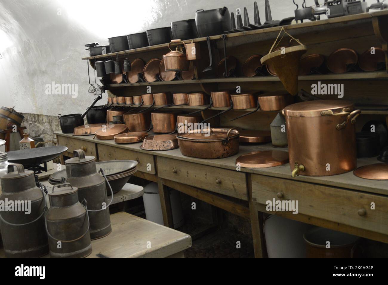 Brass utensils in a well stocked castle kitchen Stock Photo