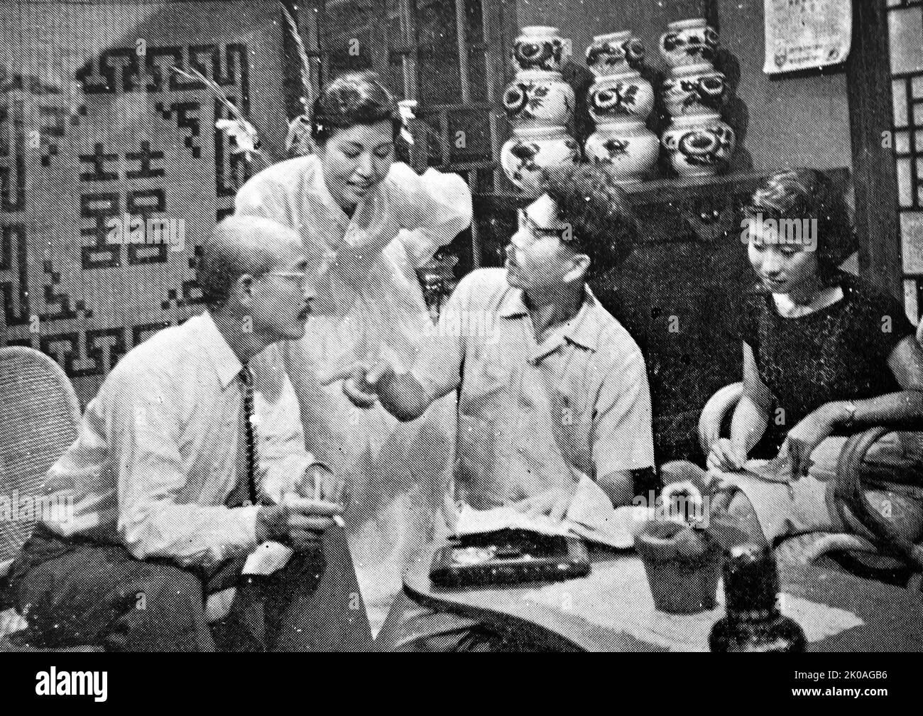 A Shooting Scene of the movie 'Sungbang Pigok (Elegy in a Buddhist Cell)'. The director (center) holds a discussion with the actors and actresses. Stock Photo