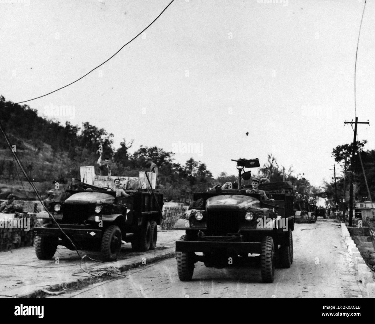 Korean War: Inchon Invasion, September 1950. U.S Marine trucks loaded with supplies start across causeway from Wolmi Do Island to Inchon, Korea, September 20, 1950. Stock Photo