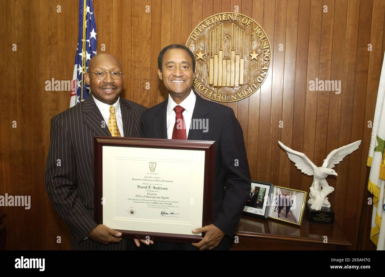 Secretary Alphonso Jackson with David Anderson - Judge David Anderson, newly-appointed Director of the Office of Hearings and Appeals, visiting Secretary's office for meeting with, and receipt of appointment certificate from, Secretary Alphonso Jackson at HUD Headquarters. Secretary Alphonso Jackson with David Anderson Subject, Judge David Anderson, newly-appointed Director of the Office of Hearings and Appeals, visiting Secretary's office for meeting with, and receipt of appointment certificate from, Secretary Alphonso Jackson at HUD Headquarters. Stock Photo