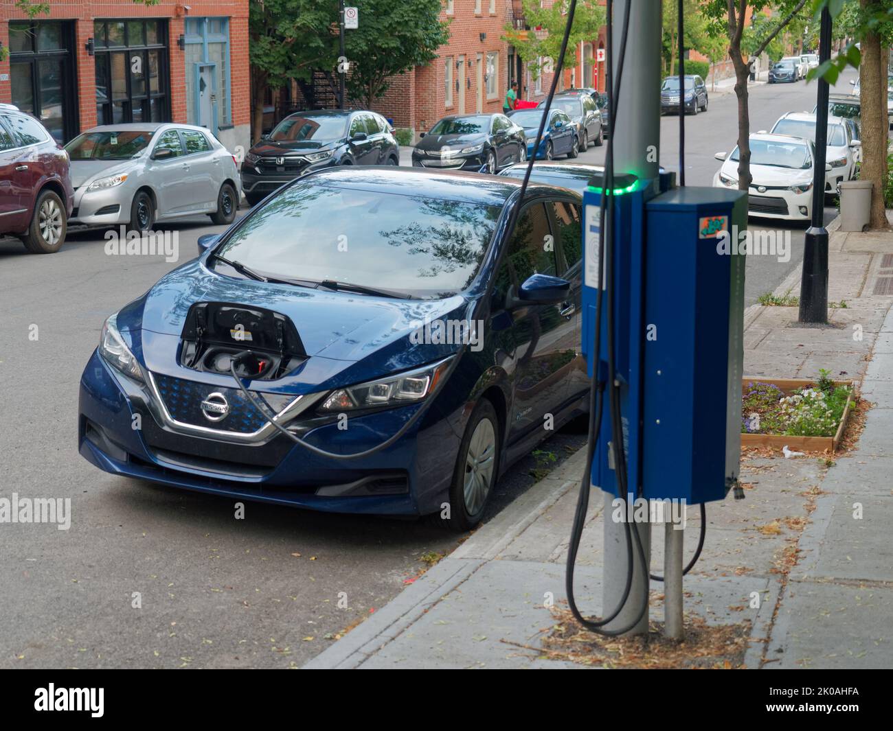 Electric car public charging station in downtown Montreal. Quebec,Canada Stock Photo