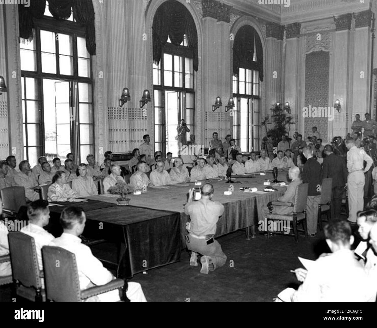 Japan Surrenders in the Government Building at Keijo (Seoul), Korea, 9 September 1945. The Japanese delegation is on the right side of the table. U.S. representatives, on the opposite side of the table Stock Photo